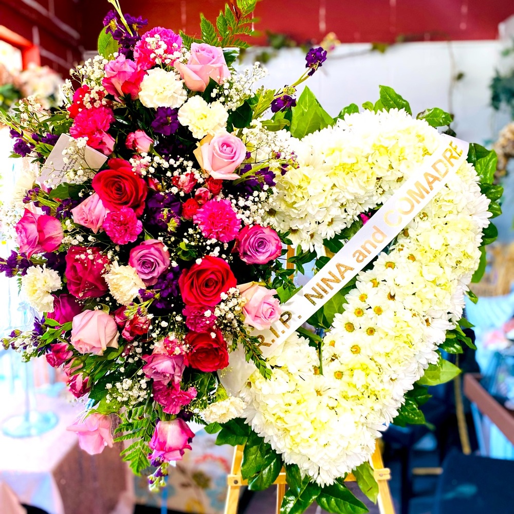 Sympathy  standing spray Heart made with Fresh Flowers with a  message Sash .